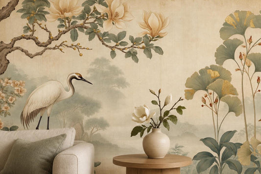 A close-up view of the vintage-style wall mural featuring a white crane standing beneath a flowering magnolia tree, beside a small side table holding a vase of flowers.