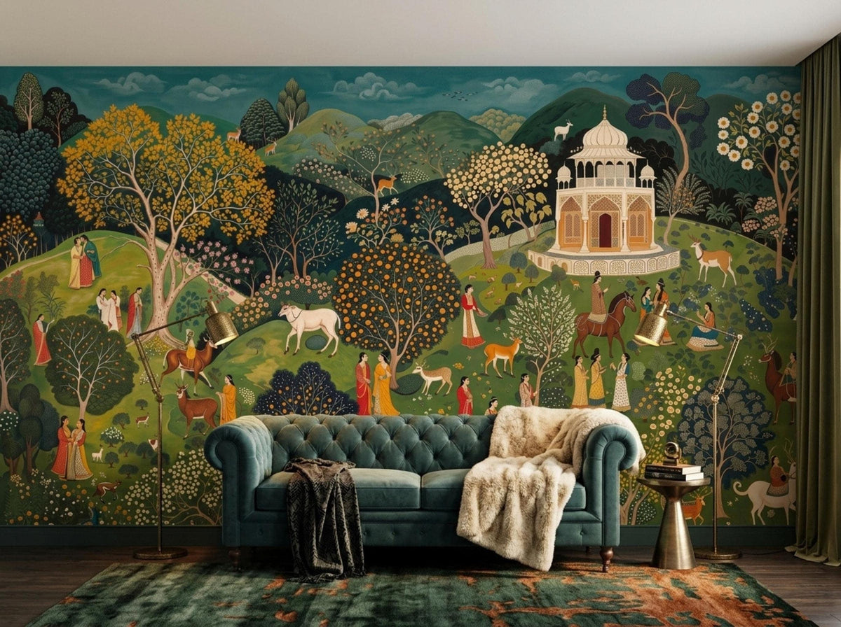 A teal traditional landscape wall mural serves as a backdrop for a blue tufted sofa with a draped throw blanket.