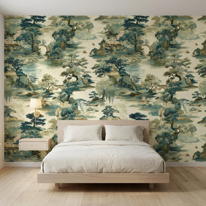 A bedroom features Chinoiserie landscape wallpaper behind a wooden bed frame with two pillows and a lit wall sconce.
