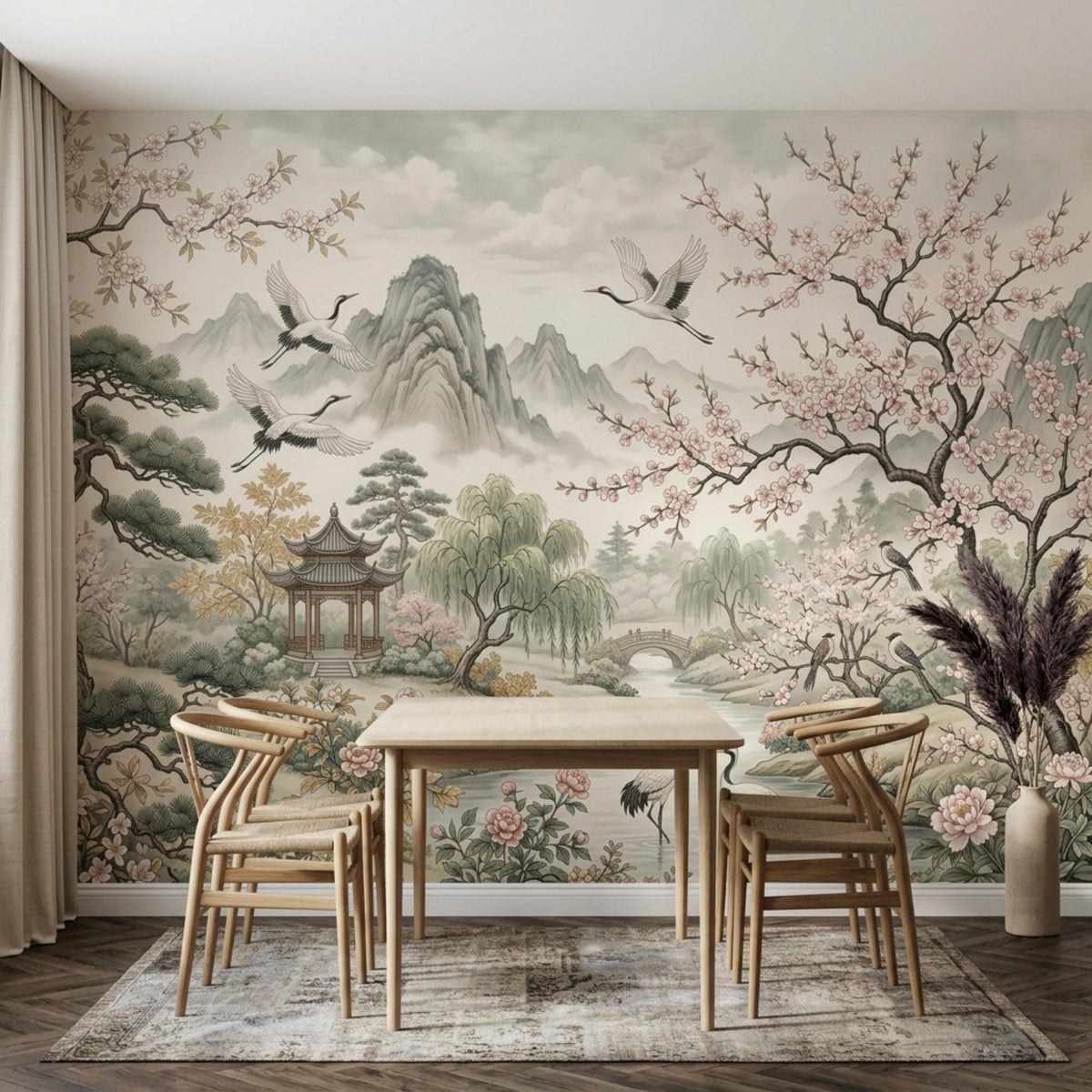 A dining area with a light wood table and chairs set on a patterned rug, against a backdrop of a large wall mural depicting a serene oriental landscape.
