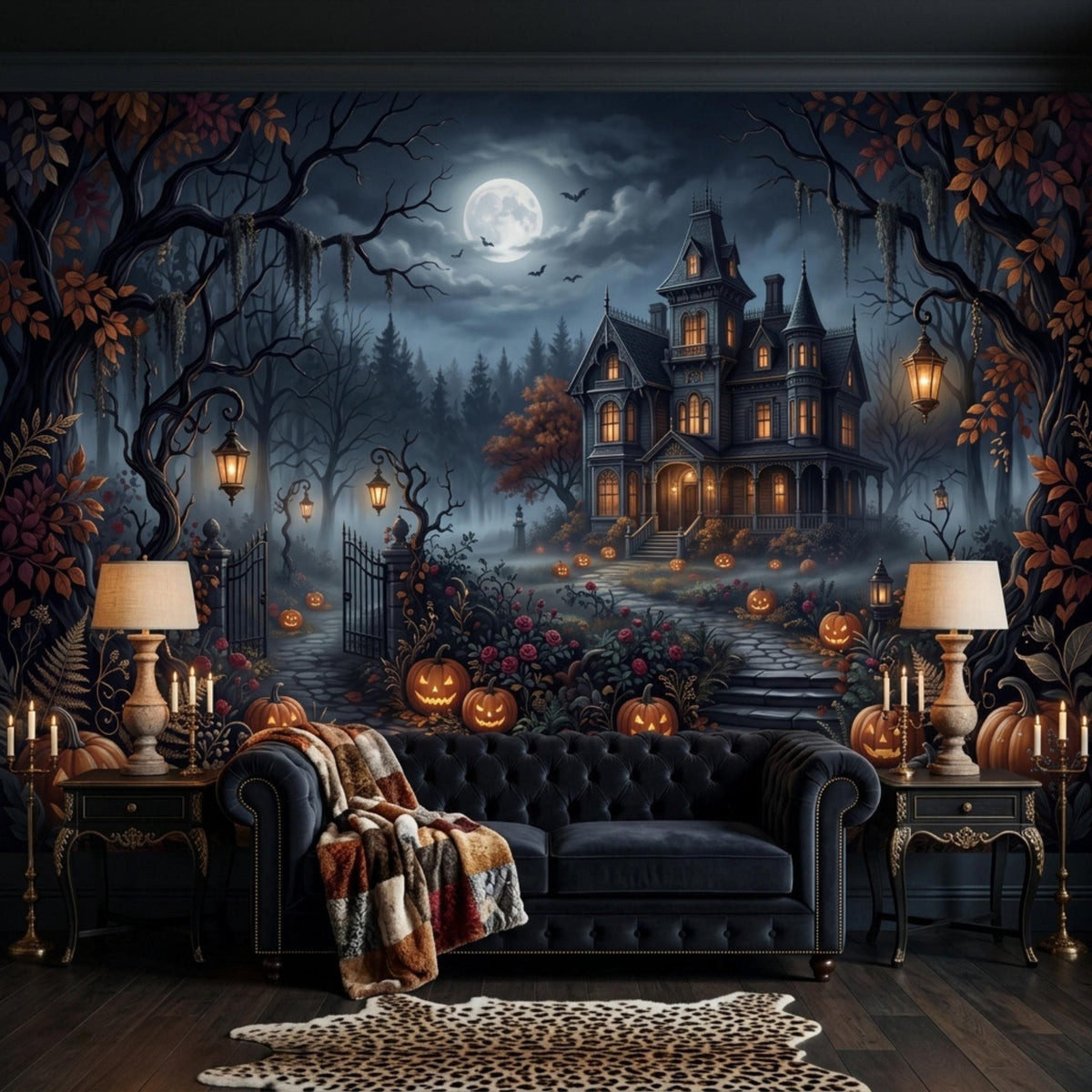 A dark velvet sofa with a patterned throw blanket sits before a gothic haunted house mural, flanked by two side tables with lit candles and lamps.