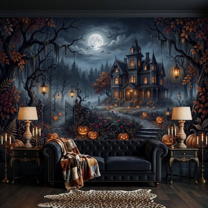 A dark velvet sofa with a patterned throw blanket sits before a gothic haunted house mural, flanked by two side tables with lit candles and lamps.