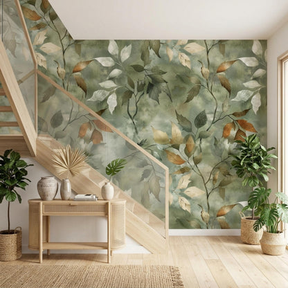 A wooden console table sits in a stairwell with sage green botanical wallpaper and potted plants.