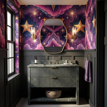 A dark green ribbed vanity vanity with a gold faucet and a rounded mirror hangs on a wall covered in whimsical purple galaxy wallpaper.