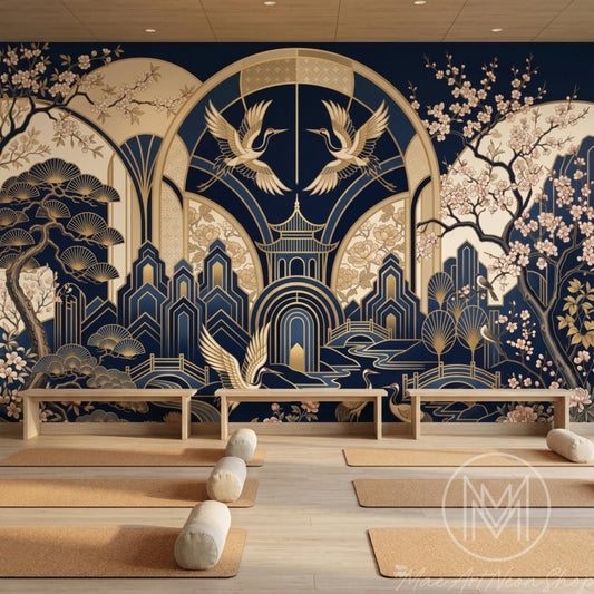 A yoga studio features a navy and gold Art Deco crane wallpaper mural on the back wall above yoga mats.