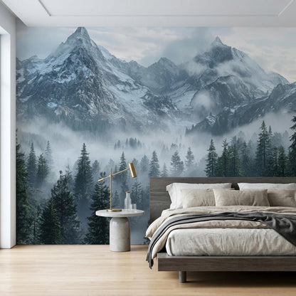 A bedroom features a large mountain forest wall mural behind the bed showing snowy peaks and foggy evergreen trees.
