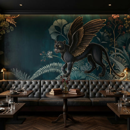 A restaurant interior with a dark green wall mural featuring a winged black panther and botanical elements, dark tufted booths, and wooden tables.