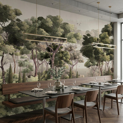 A restaurant dining area featuring wooden tables, chairs, and benches against a moody woods wall mural.