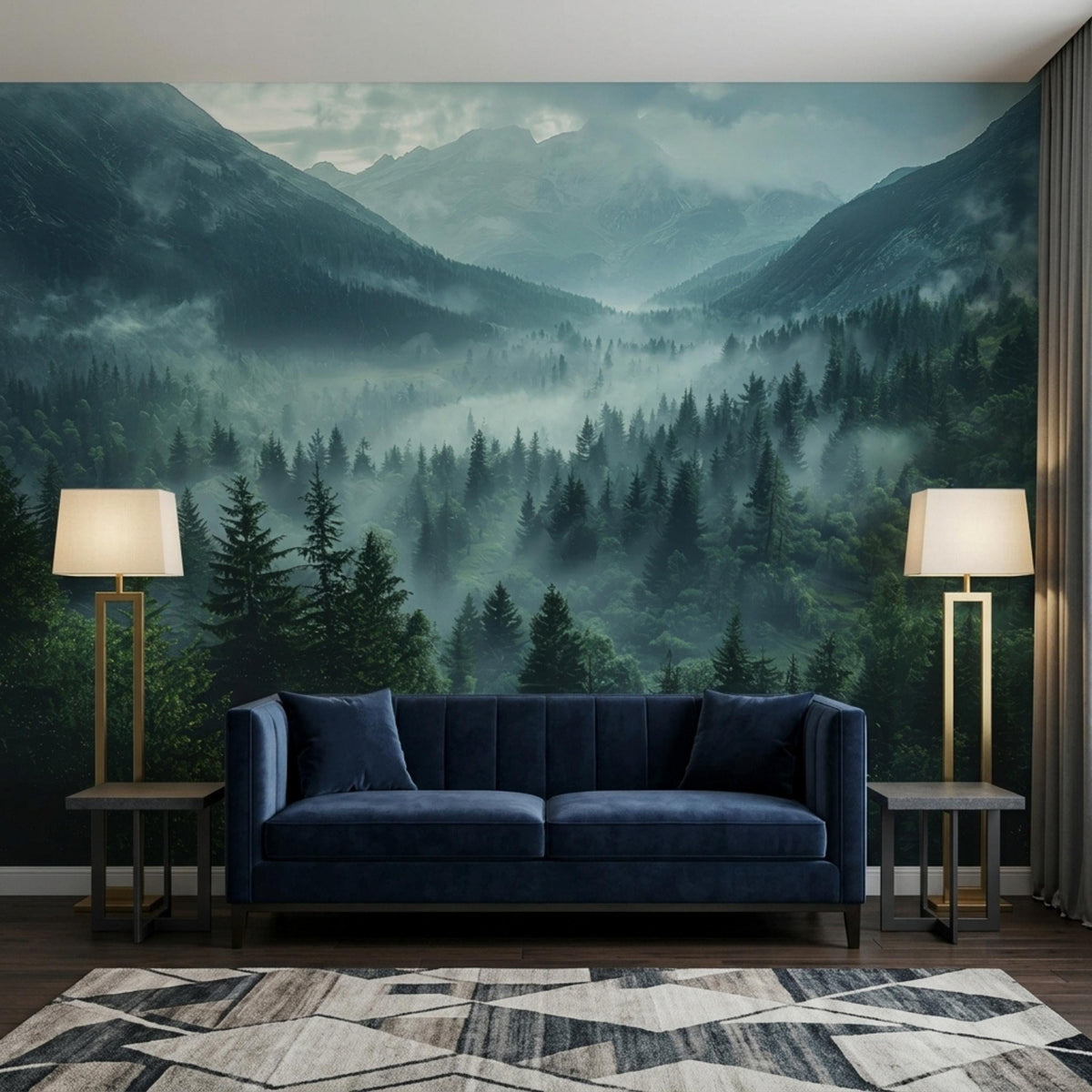 May include: A navy blue velvet sofa with two matching cushions sits before a wall mural depicting a misty mountain forest landscape. Two gold floor lamps with white rectangular shades stand on either side of the sofa on a geometric rug.