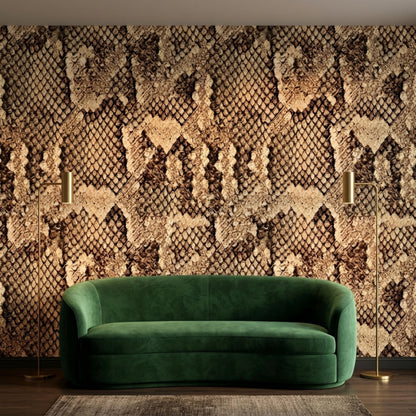 A green velvet curved sofa is positioned in front of a dark brown snake skin pattern accent wall with two floor lamps.