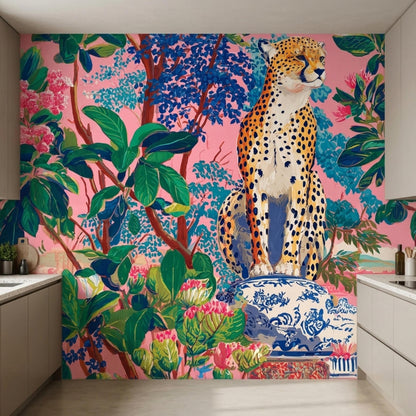 A modern kitchen counter sits against a pink leopard jungle wallpaper mural featuring tropical foliage and a large feline.
