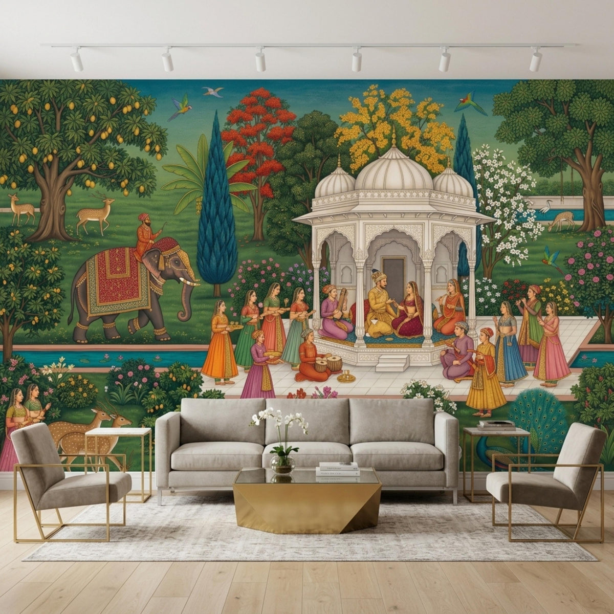 An Indian Mughal miniature art wall mural is displayed behind a living room set that includes a grey sofa, two armchairs, a gold coffee table, and a rug.