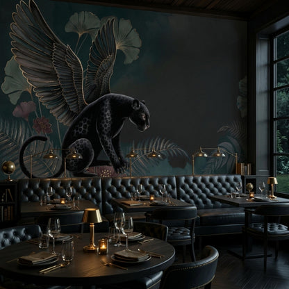 A moody restaurant interior features a large botanical wallpaper mural of a black panther with large wings against a dark teal background.