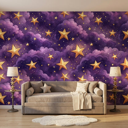A grey sofa with pillows sits on a round rug in front of the purple and gold star wallpaper.