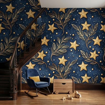 A blue rocking chair and wooden storage box are positioned against a wall covered in dark navy wallpaper with gold stars and branches.