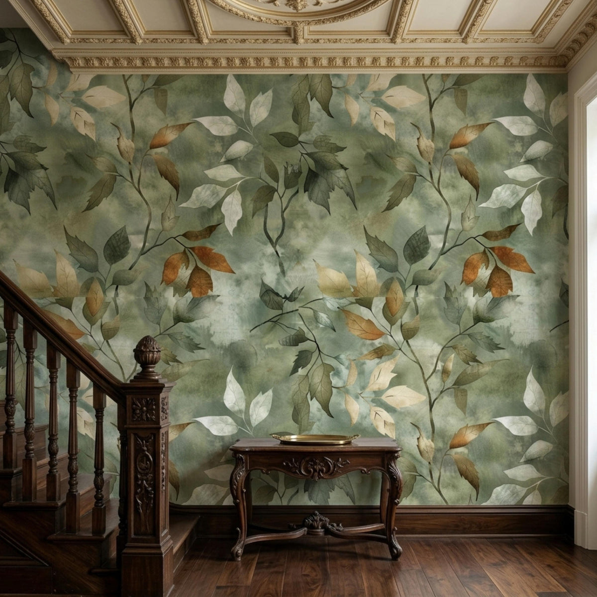 A small wooden console table is placed against a sage green botanical watercolor wallpaper near wooden stairs.