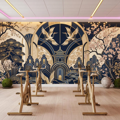 Stationary exercise bikes facing a large wall mural featuring a Japanese Art Deco navy blue and gold design with cranes and pagodas.