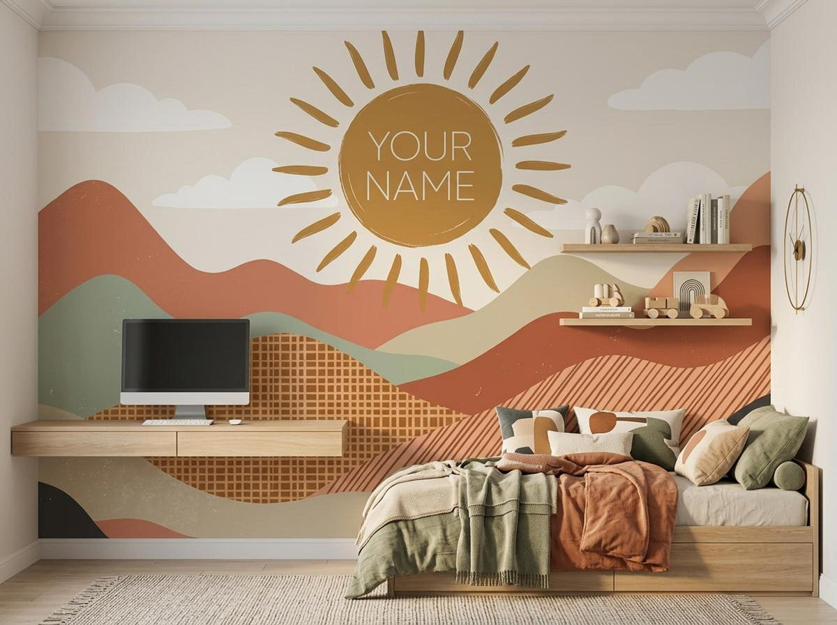 A childs bedroom features a colorful boho sun and mountain wall mural with YOUR NAME, a wooden bed, floating shelves, and a wall-mounted desk.