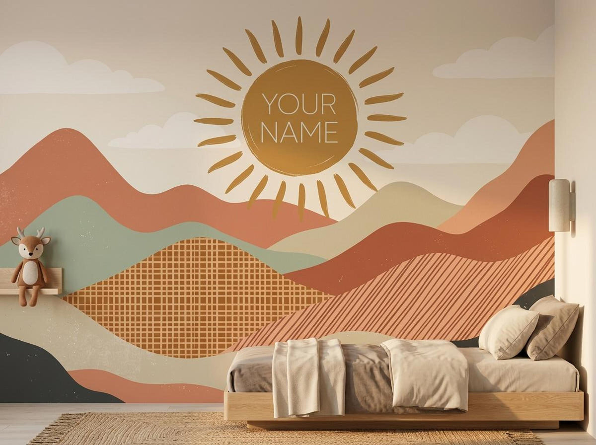 A wooden bed sits against a large wall mural depicting abstract terracotta mountains and a sun with the text YOUR NAME.