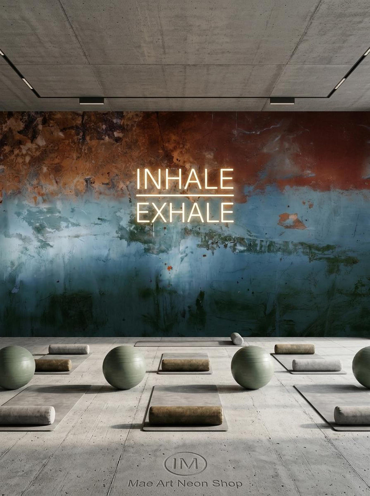 A yoga studio floor with mats and exercise balls in front of a distressed copper and blue wall mural with glowing neon text.