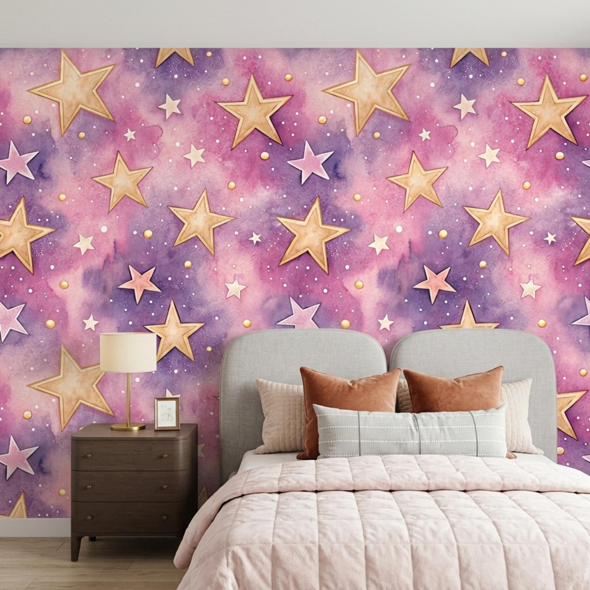 A bedroom with watercolor purple and pink galaxy star wallpaper, a bed with pink bedding, and a nightstand.