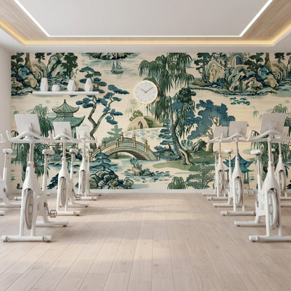 A gym with multiple stationary bikes aligned in front of an Asian landscape mural.