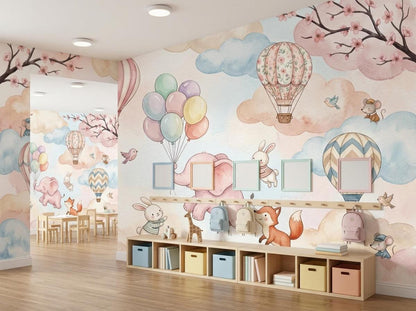 A wide view of a room with the watercolor mural on the walls, a row of low cubby shelves, and wooden toys.