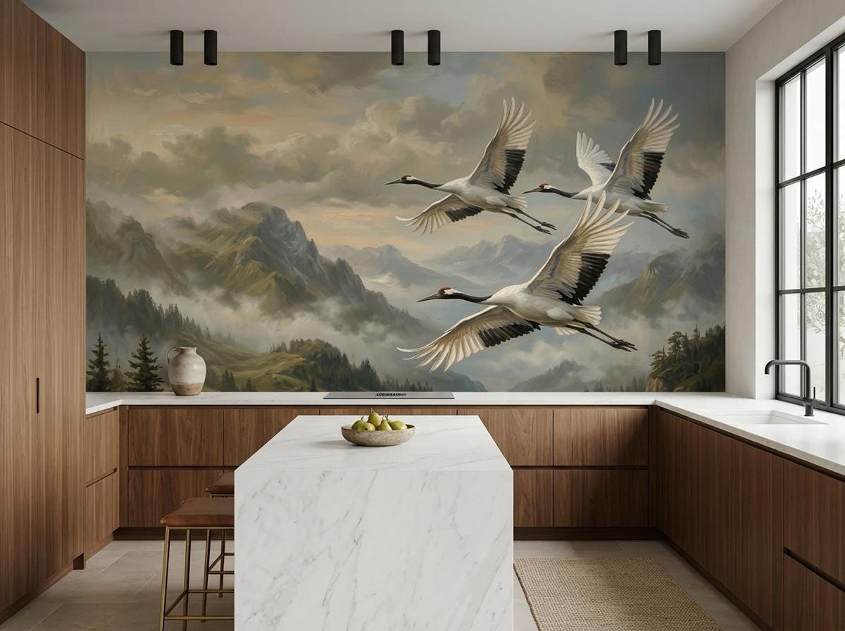 A kitchen with dark wooden cabinets and a marble island backed by a large wall mural of flying cranes and mountains.