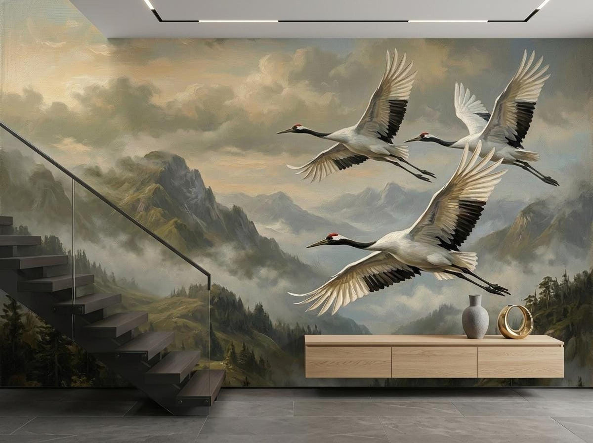 A large wall mural featuring flying cranes over misty mountains near stairs and a console table.