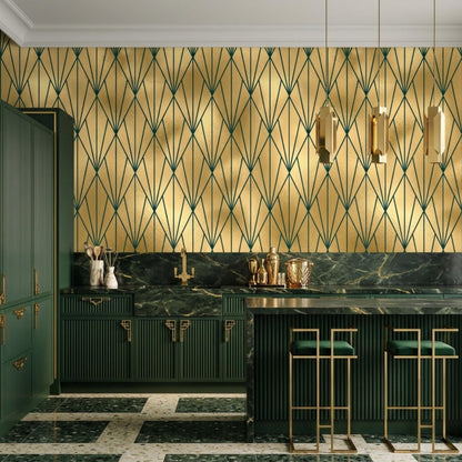 A modern kitchen features green cabinets and marble counters against gold and dark green art deco geometric wallpaper.