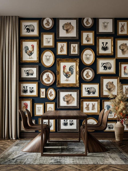 A dining space features a wooden table and curved chairs set against a dark blue wall covered in an extensive gallery of framed vintage animal illustrations.
