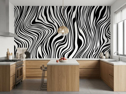A modern kitchen with wooden cabinets and a center island against a wall covered in black and white curved line wallpaper.