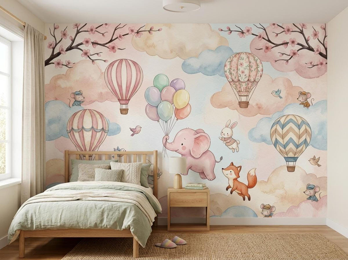 A twin bed with green bedding is positioned in front of the whimsical watercolor wall mural.
