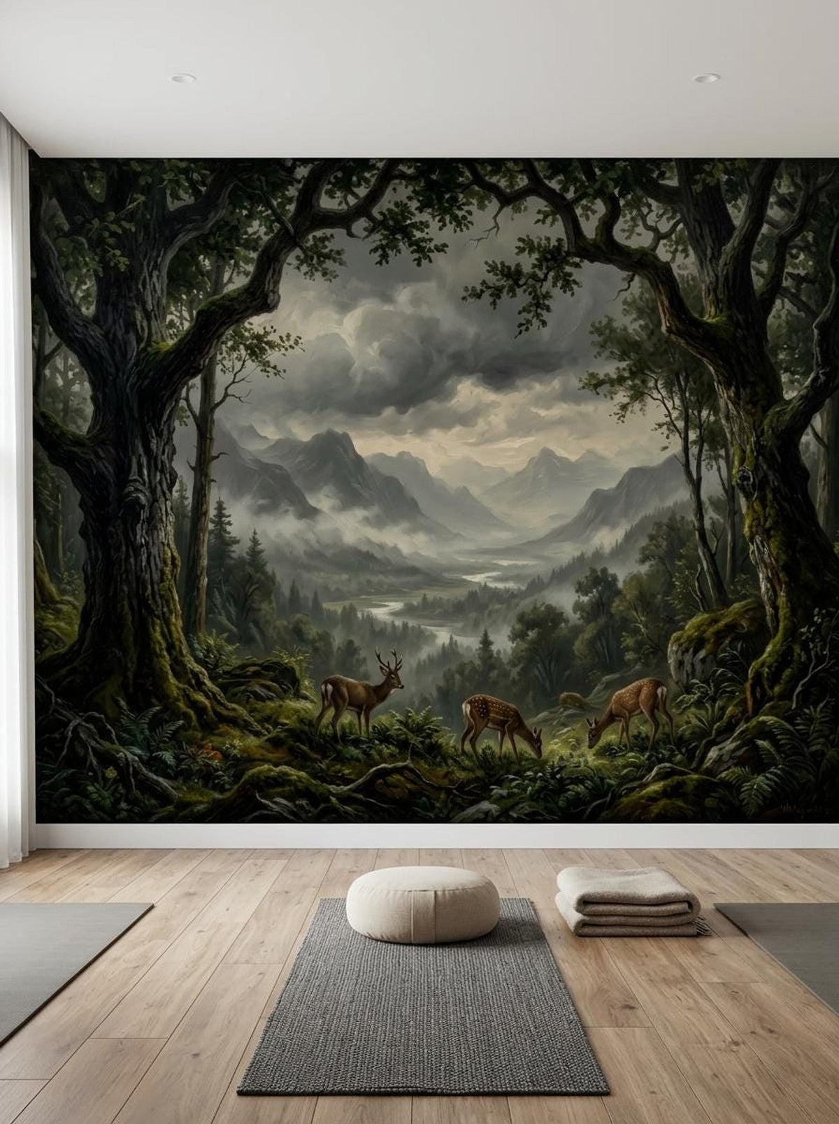 An empty room with a large forest mural wallpaper depicting deer in a foggy valley, viewed above wooden flooring.