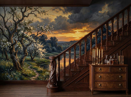 A wooden staircase with turned balusters stands beside a large wall mural depicting a river landscape with blossoming trees at sunset.