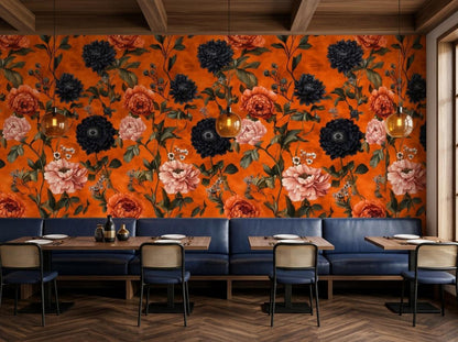 A restaurant dining area has dark blue booths and wooden tables set against a vibrant burnt orange and black floral wall.