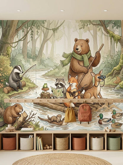A woodland animal wall mural showing a bear, fox, raccoon, and deer on a raft, with a badger fishing and a beaver on the riverbank, set behind a wooden shelf unit.