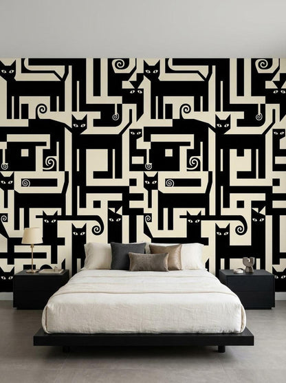 A bedroom features an accent wall covered in a black and cream geometric wallpaper with interlocking cat silhouettes behind a bed with neutral bedding.