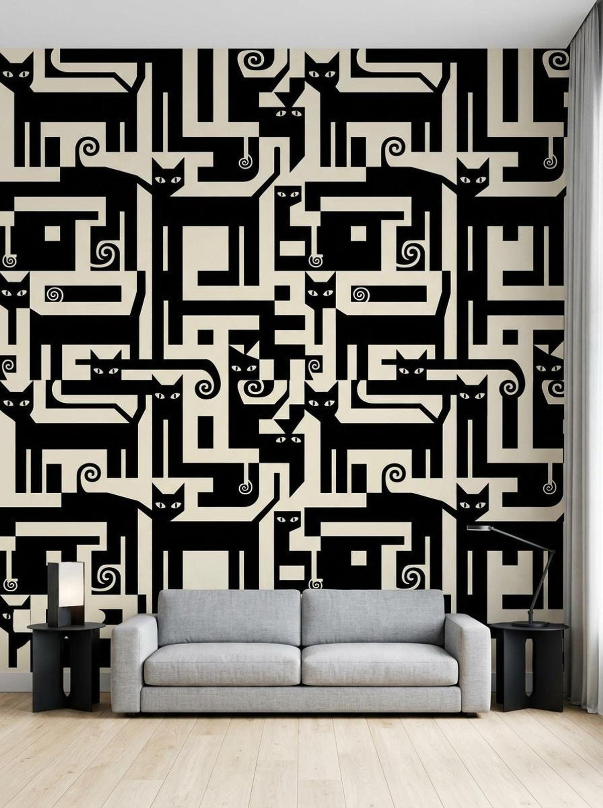 A grey sofa sits in a living room against a wall covered in graphic black and cream wallpaper featuring abstract geometric cat shapes.