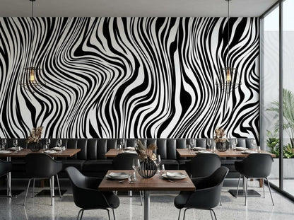 A restaurant interior features a monochrome wavy patterned wallpaper behind black booths and tables with pendant lights.