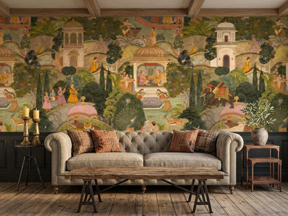 A tufted grey sofa sits before a detailed Indian miniature painting mural wallpaper, accompanied by a rustic wooden coffee table and side tables with decor.