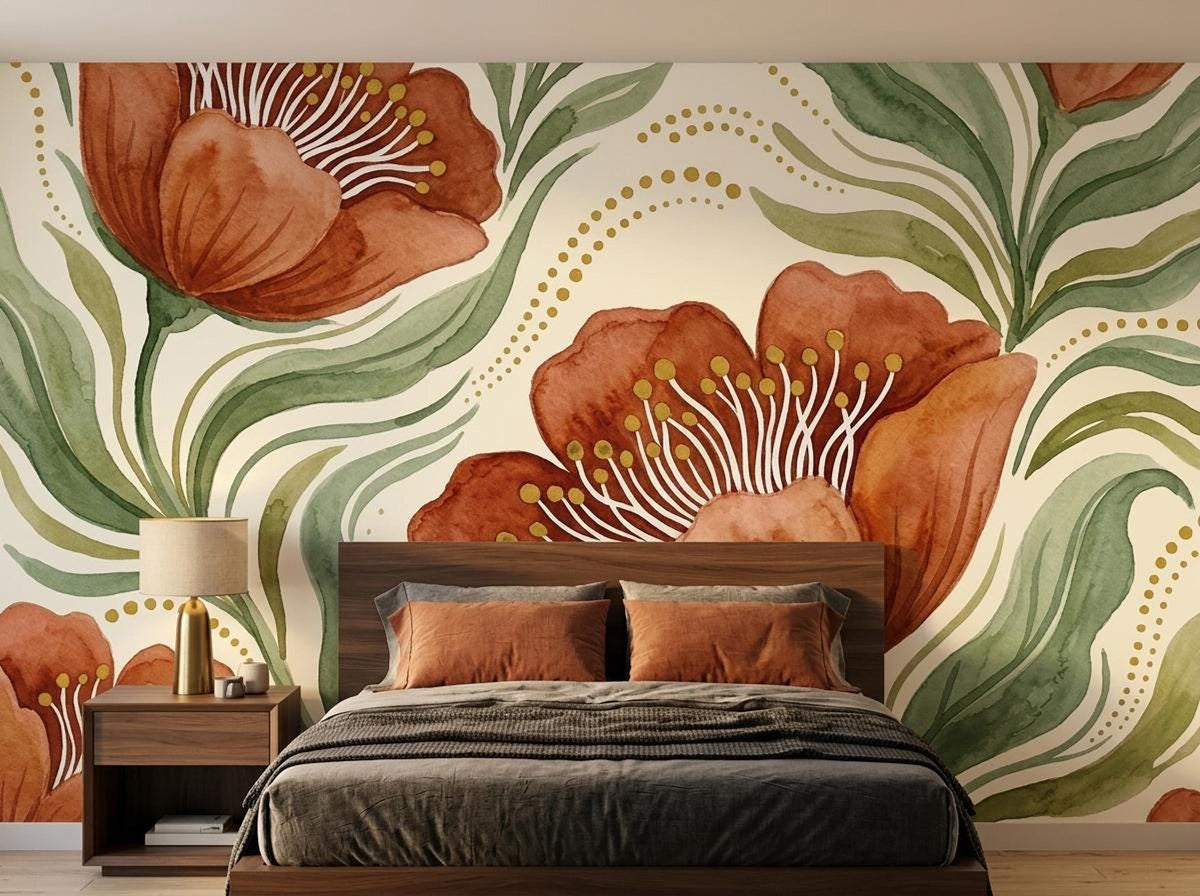 Earthy floral watercolor wall mural with large rust-orange flowers and green leaves behind a bed with dark bedding and terracotta pillows.