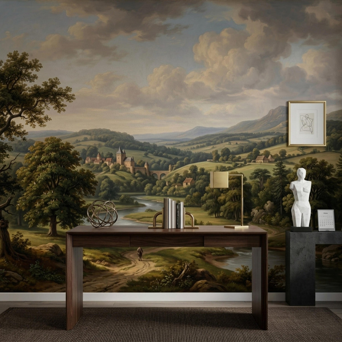 A rustic countryside oil painting wall mural featuring a river winding through hills toward a distant castle, shown behind a wooden desk.