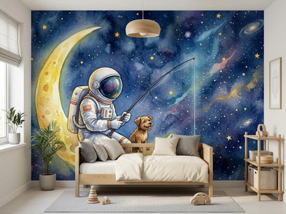 A child's room with a wooden bed, a nightstand, and wall shelving positioned in front of a watercolor galaxy mural showing an astronaut and a dog fishing on a crescent moon.