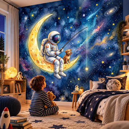 A child sits on a wooden floor in a bedroom, looking at a wall mural depicting an astronaut and a dog fishing on a crescent moon amidst a starry watercolor galaxy.