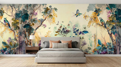 A bedroom with a bed against a watercolor botanical wallpaper featuring trees, flowers, and birds in teal, yellow, and purple tones.