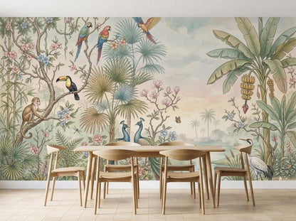 The jungle wallpaper mural as the backdrop for a dining table set with wooden chairs on a light wood floor.