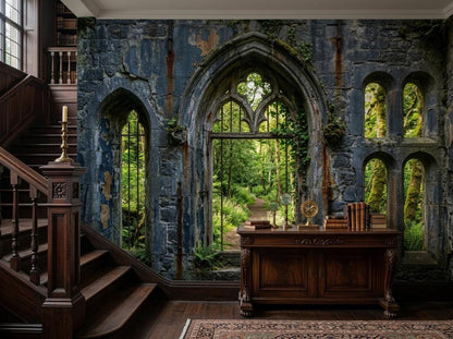 A dark academia study room with a stone ruin wallpaper mural of an arched forest window, a dark wood staircase, and a console table with books and a globe.