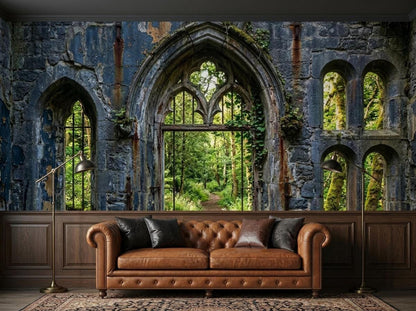 A sitting room with a stone ruin wallpaper mural depicting an overgrown castle wall and forest view, featuring a brown leather tufted sofa and two floor lamps.