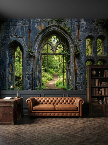 A living room featuring a stone ruin wallpaper mural with an arched window view of a forest, a brown leather tufted sofa, and a dark wood desk.